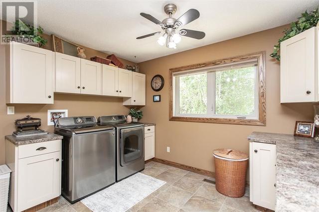 Large Laundry Room on the main level could be converted to a 4th Bedroom is desired | Image 29