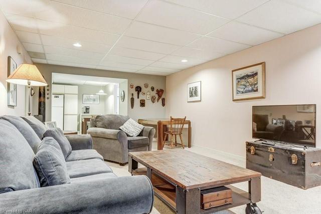 Large open living area in basement | Image 13