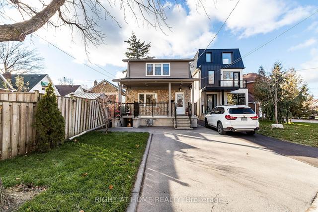 24 Syndicate Ave, House detached with 2 bedrooms, 4 bathrooms and 2 parking in Toronto ON | Image 1