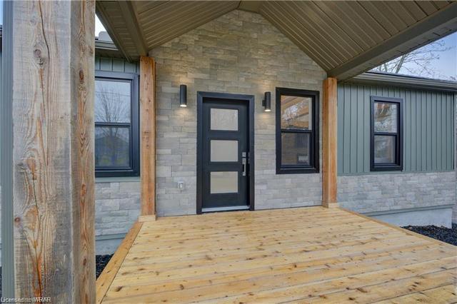 Step onto the covered porch (2022) and enter a world where rustic elegance meets modern convenience. | Image 34