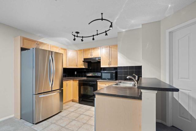 1124 - 60 Panatella Street Nw, Condo with 2 bedrooms, 2 bathrooms and 1 parking in Calgary AB | Image 3