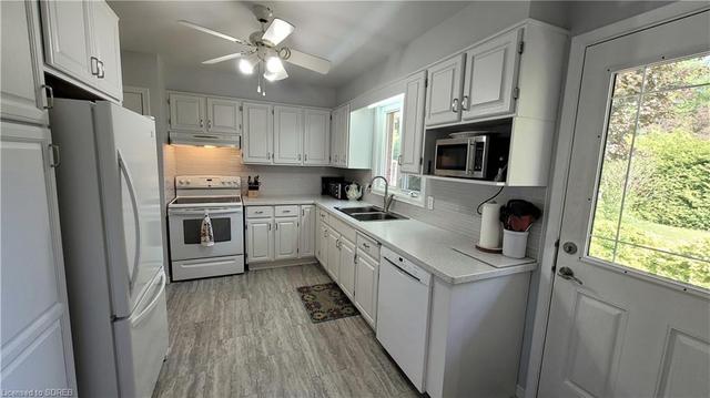 Updated Kitchen with tons of cabinets, pantry and access to the rear yard | Image 4