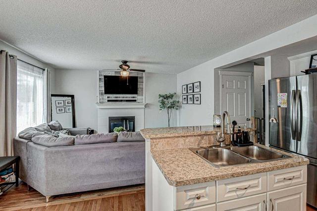 22 Cimarron Grove Rise, House detached with 3 bedrooms, 2 bathrooms and 2 parking in Okotoks AB | Image 16