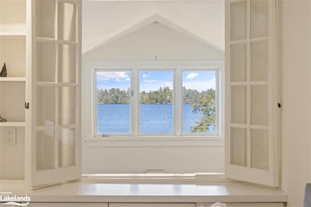 Entry to primary bedroom with built in cabinetry and desk area | Image 19