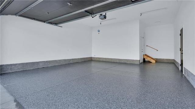 Garage with epoxy flooring | Image 34