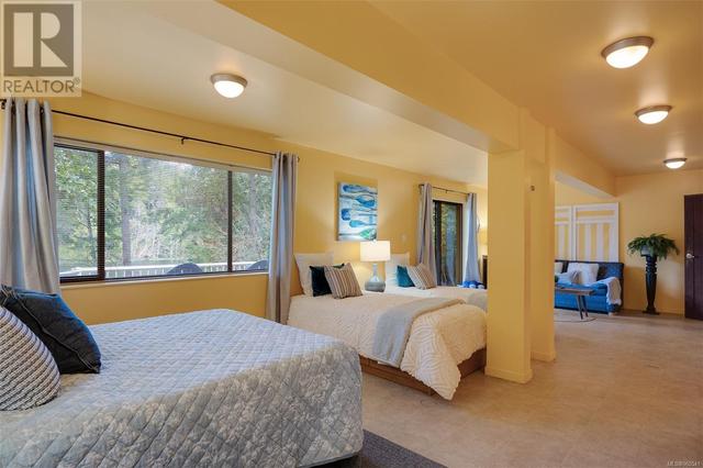 The rec room is perfect as a third bedroom with lots of room for multiple beds | Image 25