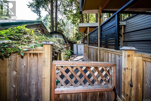 Gate leads to your private yard with storage shed. | Image 13