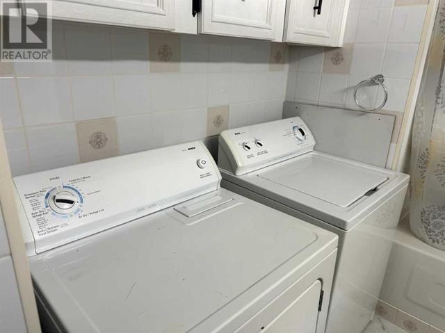Laundry equipment in the bathroom | Image 11