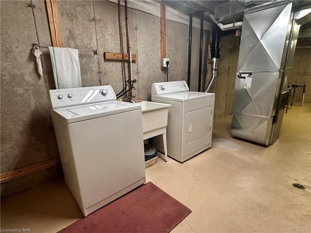 The basement also has a laundry room, with a second set of washer and dryer. | Image 31