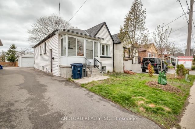 65 Manitoba St, House semidetached with 2 bedrooms, 2 bathrooms and 2 parking in Toronto ON | Image 1
