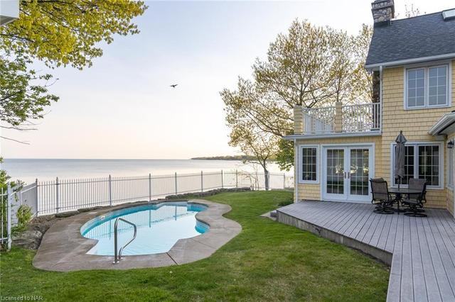 Lakeside deck and heated pool. | Image 42