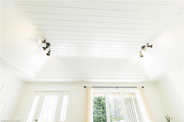 One of the more impressive features in this custom home is the oversized & extra deep vaulted tray ceiling finished with a timeless shiplap. | Image 13