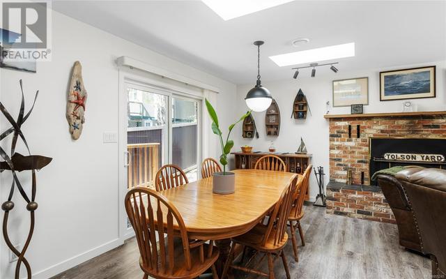 Dining area with side deck access. | Image 8