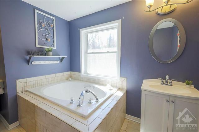 Soaker tub in the ensuite is your oasis after a long day | Image 13