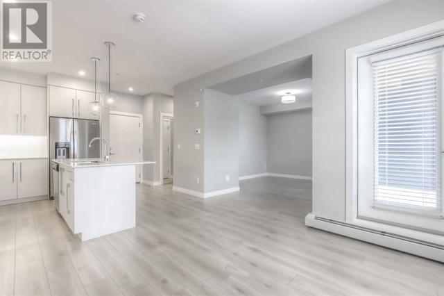 303, - 383 Smith Street Nw, Condo with 1 bedrooms, 2 bathrooms and 1 parking in Calgary AB | Image 8