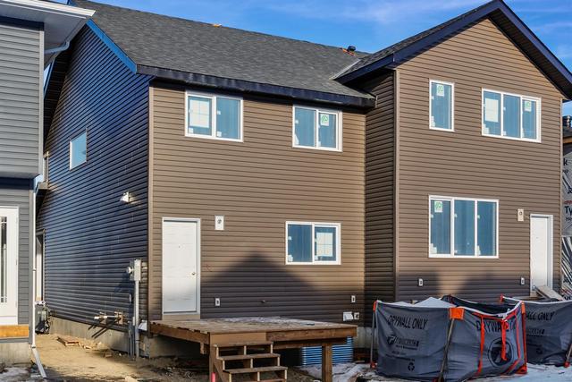161 Ambleton Drive Nw, Home with 3 bedrooms, 2 bathrooms and 2 parking in Calgary AB | Image 2