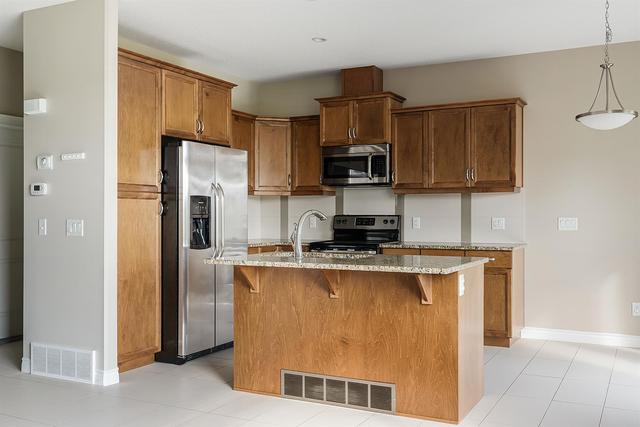 2 - 441 Millennium Drive, Home with 3 bedrooms, 3 bathrooms and 4 parking in Wood Buffalo AB | Image 2