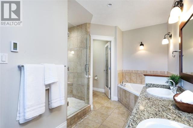 Large tiled shower and separate tub in Primary bed | Image 22