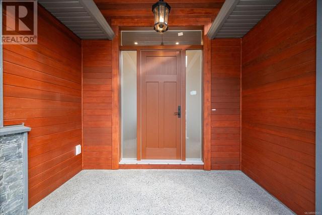 Richly Stained Clear Cedar frames the Entrance to the home | Image 3