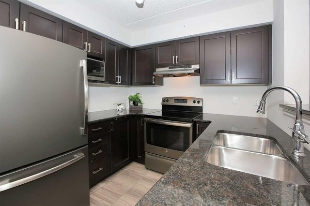 203 - 1470 Main St E, Condo with 2 bedrooms, 1 bathrooms and 2 parking in Milton ON | Image 2