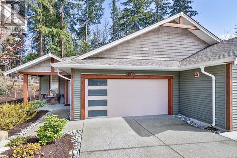 Front of home with double garage and large driveway (parking for 6) | Card Image