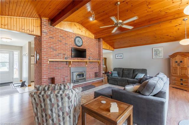 Family Room!  Ceiling Beam details.  Floor to ceiling Brick Wood Burning Fireplace.  16' Vaulted Ceiling. | Image 7