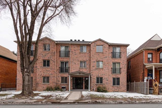 101 - 28 Victoria Ave N, Condo with 2 bedrooms, 1 bathrooms and 1 parking in Hamilton ON | Image 1