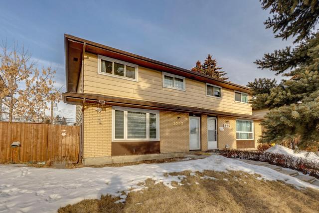 3227 Doverville Crescent Se, Home with 4 bedrooms, 2 bathrooms and 2 parking in Calgary AB | Image 1