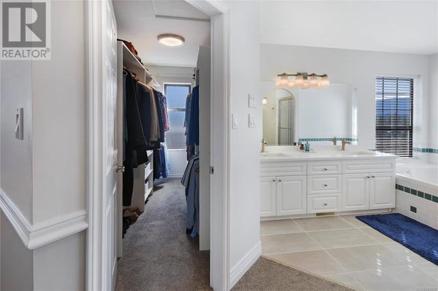 Large walk in closet with the ensuite on the right | Image 28