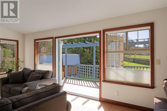 French doors leading to the sitting area deck outside | Image 10