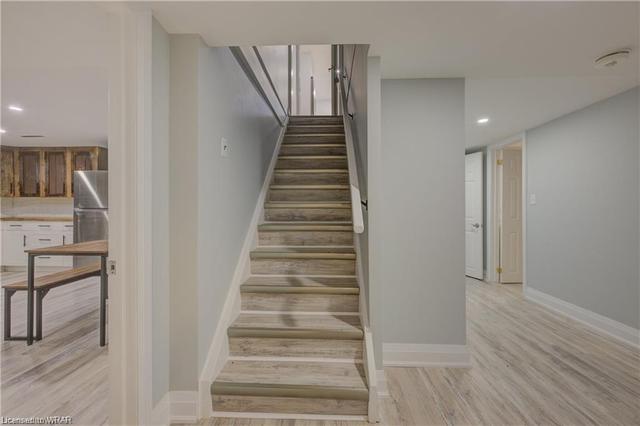 The walk-out basement with open-concept living/dining plus a full kitchen, features 2 bedrooms and would be an ideal in-law suite. | Image 16