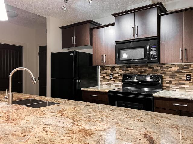 113 - 135a Sandpiper Road, Condo with 2 bedrooms, 2 bathrooms and 1 parking in Wood Buffalo AB | Image 2
