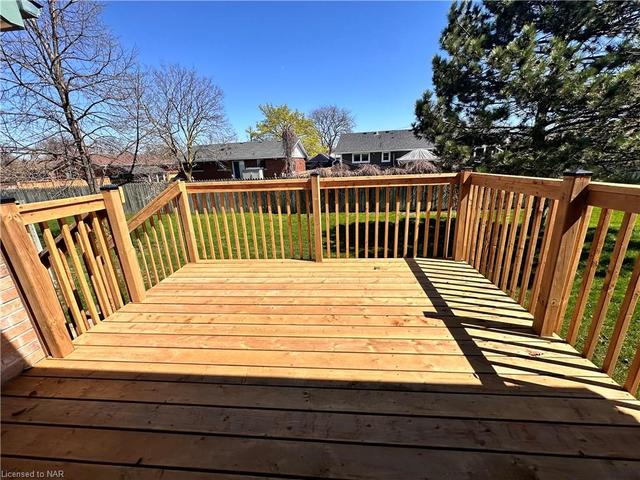 The attractive wooden deck in the backyard. | Image 32
