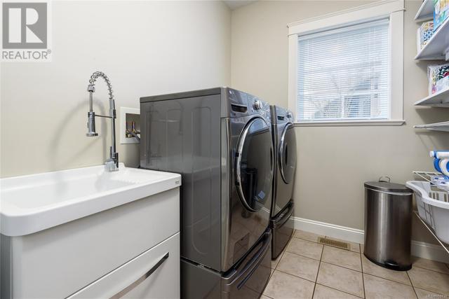 Main floor laundry room w/ front loading washer & dryer | Image 19