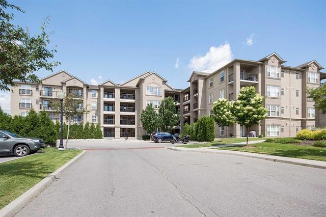 407 - 1380 Main St E, Condo with 2 bedrooms, 1 bathrooms and 1 parking in Milton ON | Image 2
