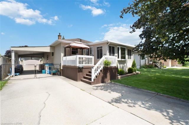 front of house with carport and detached garage | Image 1