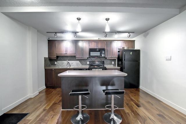102 - 1025 14 Ave Sw, Condo with 2 bedrooms, 1 bathrooms and 1 parking in Calgary AB | Card Image