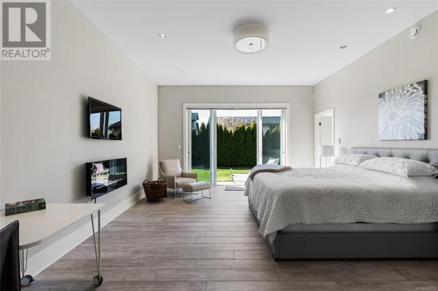Spacious primary bedroom on main floor - walk out to your private terrace | Image 21