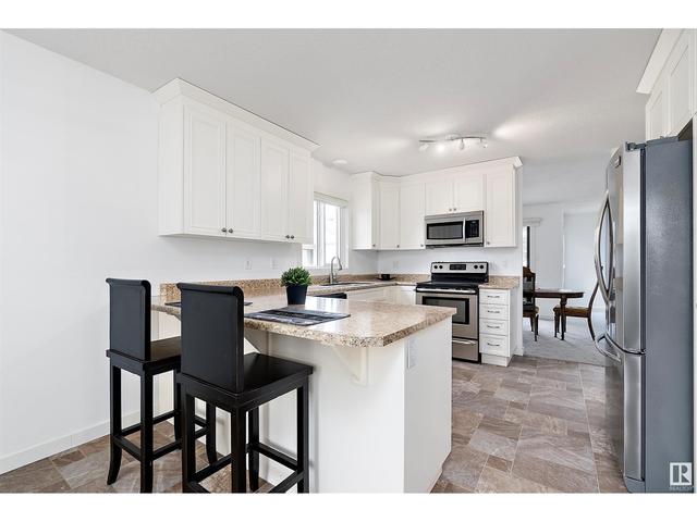 10640 153 Av Nw, House attached with 2 bedrooms, 1 bathrooms and 4 parking in Edmonton AB | Image 7