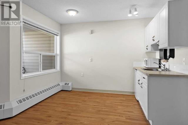Kitchen and dining nook is set up for quick in unit snacks | Image 4