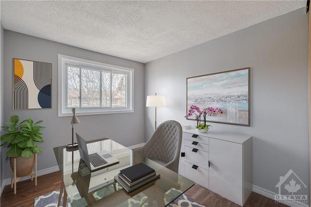 The nicely proportioned third bedroom on the second level also allows for natural light to shine through. (virtually staged photo). | Image 21