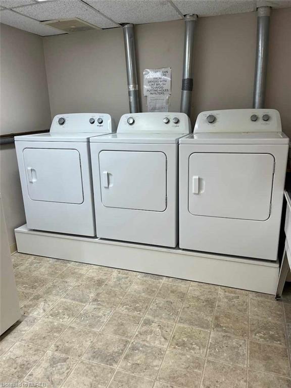 Main floor laundry dryers on a lift for easy access. | Image 45