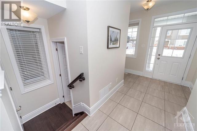 Easy access to the main level powder room & lower level. | Image 13