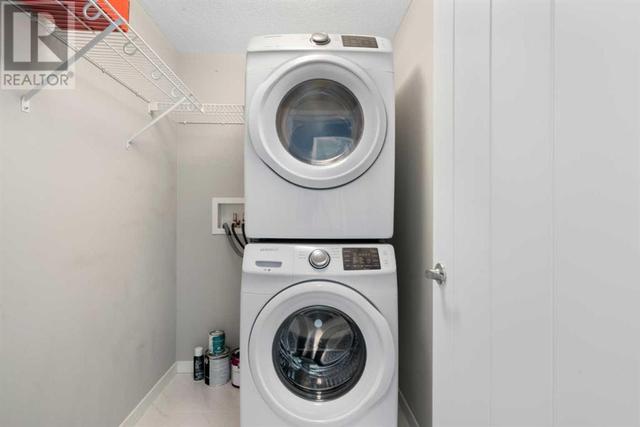 Laundry room, full size stacker washer/dryer, closet, storage, | Image 18