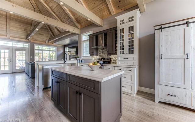 The kitchen is meticulously designed with an apron-front sink and a layout perfect for entertaining. | Image 47