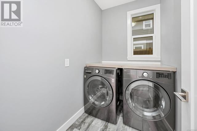 main floor laundry room off of kitchen and garage | Image 17