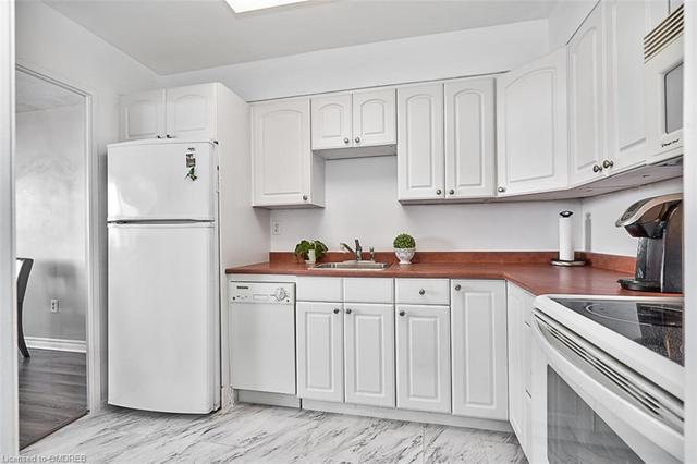 Kitchen with White Cabinetry | Image 11