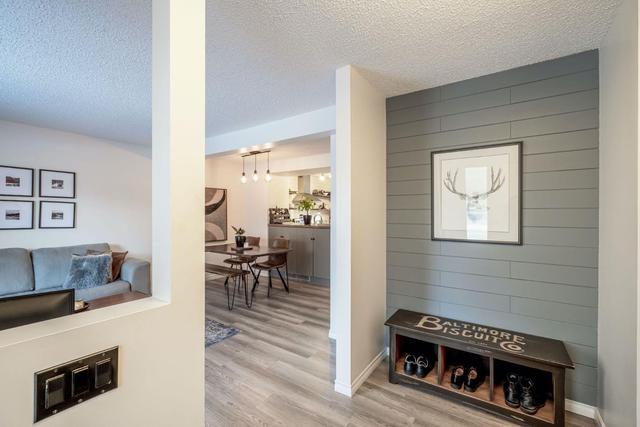 107 - 2300 Oakmoor Drive Sw, Home with 3 bedrooms, 1 bathrooms and 1 parking in Calgary AB | Image 2