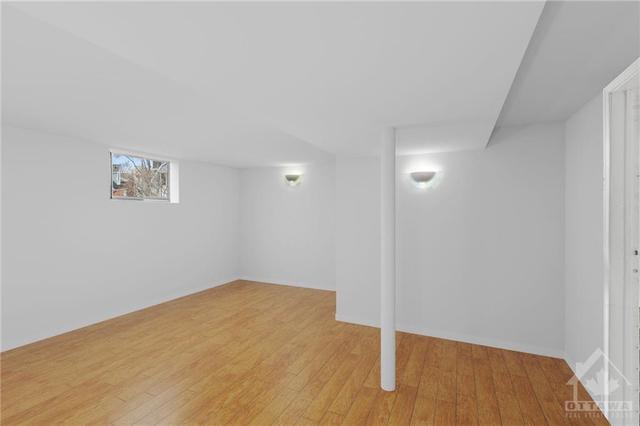 (Virtually Altered) Lower Level 1 Bedroom Apt- Living room space. | Image 20