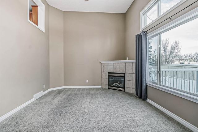 80 Crystal Shores Cove, Home with 3 bedrooms, 2 bathrooms and 2 parking in Calgary AB | Image 2